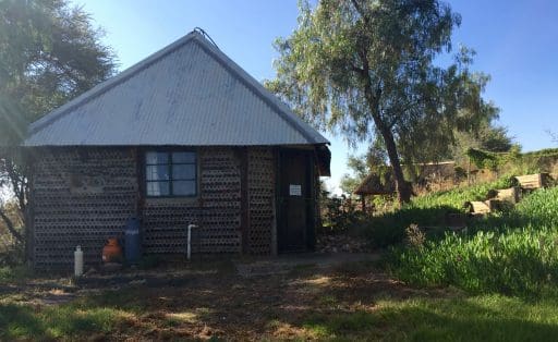 The kitchen at Andy G's Bottle House at Penduka Village. It is a true art house constructed of mortar and recycled beer bottles.