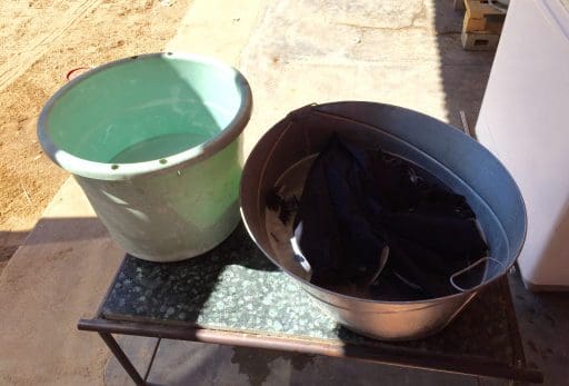 Wash basin on the right and rinse bucket on the left. Best technique, they say, is to rub the fabric on your forearm rather than on another part of the garment.