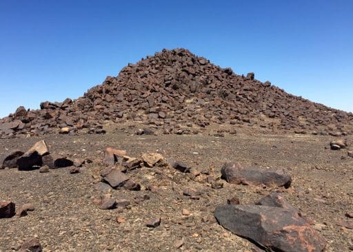 Quite often, the flatness is broken by these rock piles. I need a geologist to explain to me how these are created. They almost look manmade, but they couldn't be.