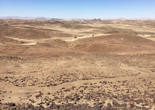 Equipment and other evidence of the mine can be seen in the distance.