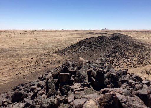 Arandis Mountain in the distance, and the peaks of Spitzkoppe further past the horizon.